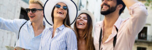 Group of happy young friends hangout on city street