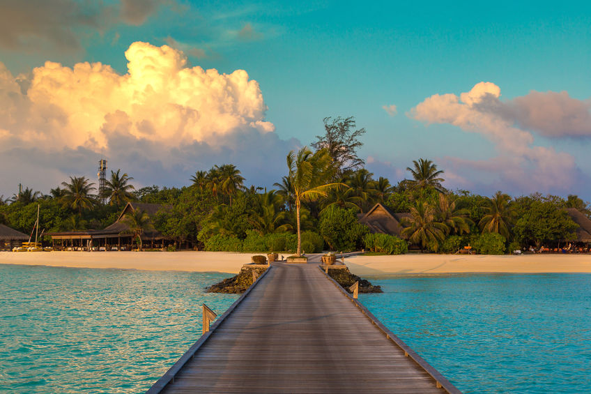 Amazing sunset at Maldives island at Luxury resort villas