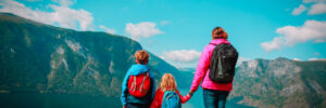 mother with kids travel in nature, looking at view, Norway, Europe