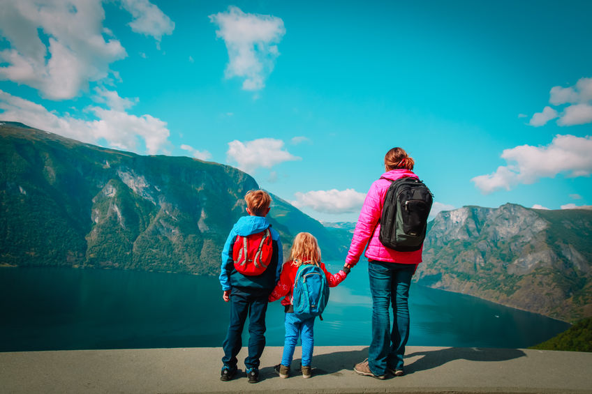 mother with kids travel in nature, looking at view, Norway, Europe